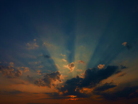 sunrise behind clouds