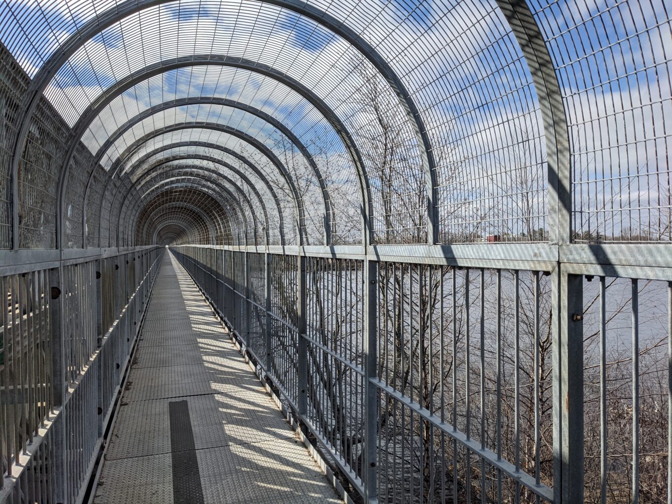covered walkway next to road bridge